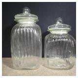 2 glass canisters 14' and 12' high