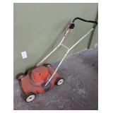 General Electric PM 12 lawnmower, plugged in and