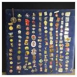 Stick pins, mostly sports, on 18' x 19' fabric o