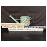 Decorative watering can with some nice signs