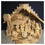 Wooden nativity scene with carved figures- barn