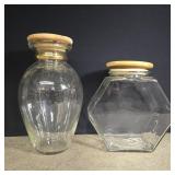 2 glass canisters with wooden lids