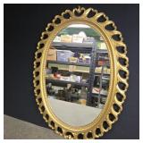 Oval mirror with gold plastic frame 25' x 18'