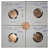 Four 2002 1 cent Euro coins and one 1 cent Euro