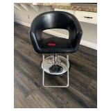 Salon chair, black metal base rounded back