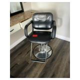 Black salon chair with metal base
