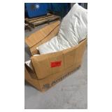 Box of hotel linens including pillow, duvet and