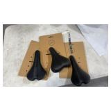 (3) black bike seats/saddles assorted