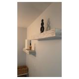 Two wall mounted shelves with contents