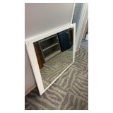 Rectangular wall mirror with a white wood frame