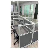 Four-person open-plan cubicle cluster featuring