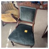 CARVED WOOD UPHOLSTERED SIDE CHAIR W/ CASTERS