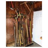 Wall of Yard tools - forks hooks saws rakes hoe