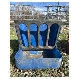 Blue wall mount hay feeder