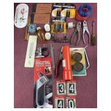 Assorted items including thermometers, batteries