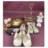 Assorted items including baby shoes, Avon