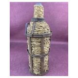 Vintage Demijohn type bottle with metal and