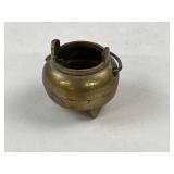 Miniature brass cauldron with handle, marked