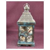 Filigree and wood lantern with assorted seashells