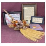 Straw broom and assorted wall decor