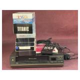 GE Video Cassette Recorder and (8) VHS tapes