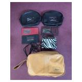 Assorted pouches, zebra striped wallet, checkbook