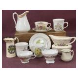 Assorted creamer, sugar, plates, and saucers