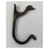 Brass duck hanger, has patina