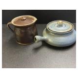 Pottery lidded teapot, has a chip on the edge and