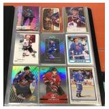 Binder of Joe Sakic cards (90)