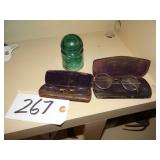 2 pair early eyeglasses and green insulator