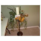 Candle floral arrangement on stand