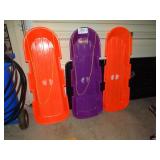 3 plastic toboggans