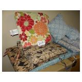 Assorted patio chair cushions and pillows