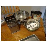 Assorted stainless grater, sifter, colanders