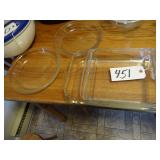 Two Pyrex baking dishes and two Pyrex pie dishes