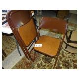 Three Samsonite padded folding chairs