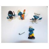 Four Smurf Figures