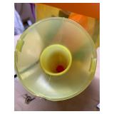 Plastic watering can full of beach, sand toys