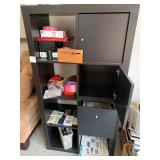 Black Storage Cabinet With Gaming Contents