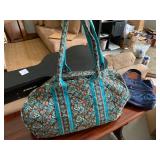 Large curves, blue and brown duffel bag