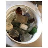 Vintage Bucket Of bottles,different colors and dif