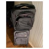 Lot of 2 Used Rolling Suit Cases