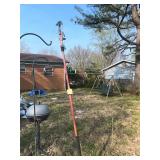 Telescoping pole pruner or pole saw used for tr..