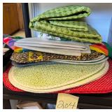 Assorted cloth place mats and vinyl table cloths