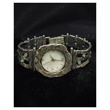 Silvertone wristwatch with blue green accents