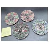 Set of four collectible 'Greenman' wall plaques