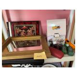 Shelf assorted items including a mirror and sma..