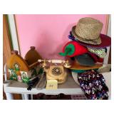 Shelf of items including vintage phone