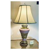 vintage table lamp featuring a brass and pink c..